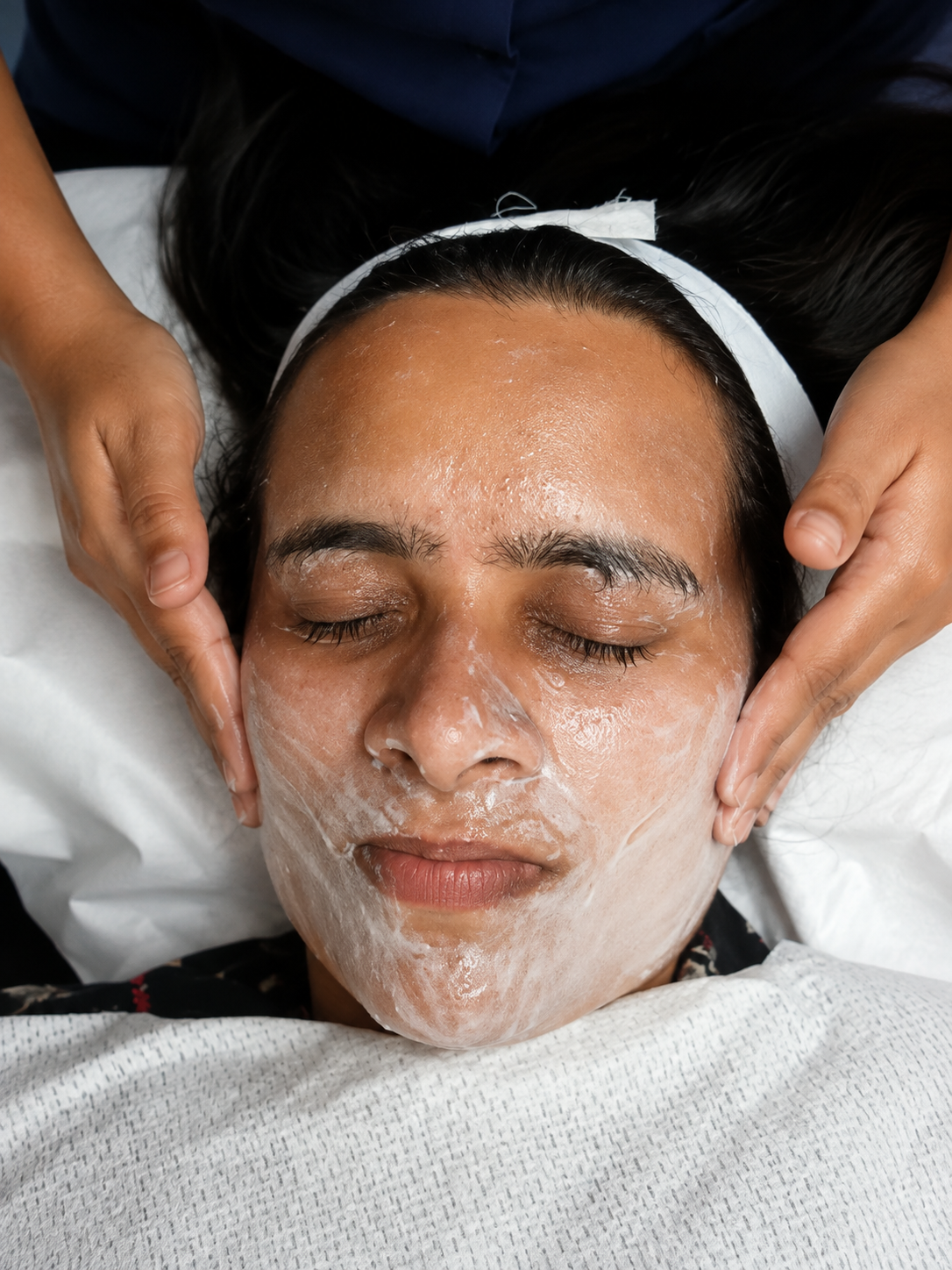 Therapist providing a massage at client's home